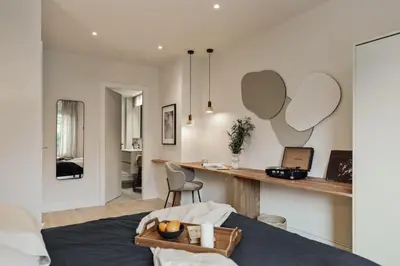a bedroom with a large mirror above a bed at Jabillos - 2 bedrooms and balcony in El Putxet in Barcelona