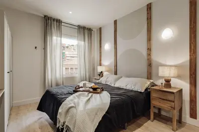 a living room with a couch and a table at Jabillos - 2 bedrooms and balcony in El Putxet in Barcelona