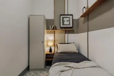 a living room with a couch and a tv at Kaftan - 5 bedrooms and balcony in Eixample Dreta in Barcelona