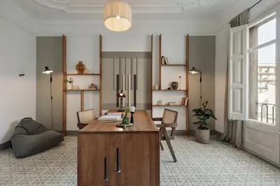 a living room with a couch and a mirror at Kaftan - 5 bedrooms and balcony in Eixample Dreta in Barcelona