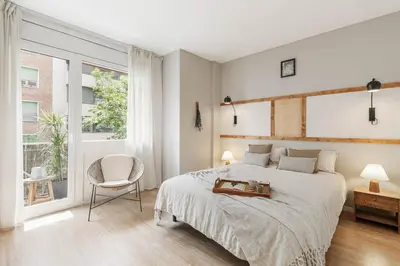 a white bathroom with two sinks and a toilet at Ravello - 3 bedroom and terrace in Sant Gervasi in Barcelona