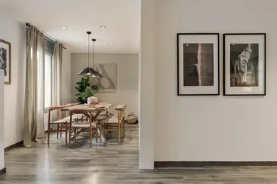 a kitchen and dining room with a table and chairs at Tarra - 4 bedrooms and terrace in Sant Pere in Barcelona