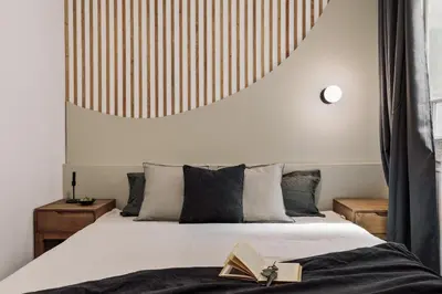 a bedroom with a bed and a pendant light at Tulum - 3 bedrooms and balcony in Gràcia in Barcelona
