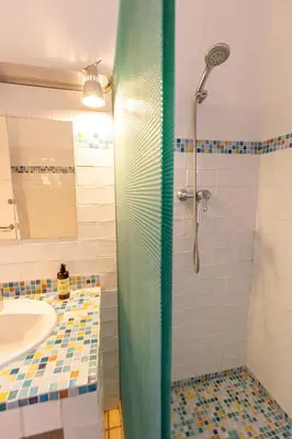 a bathroom with a shower and a sink at Sun & Sand Sanctuary - 2km to beach and 20km BCN! in Castelldefels