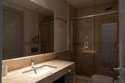 a bathroom with a sink and a shower at Paseo de Gracia Icon Apartment in Barcelona