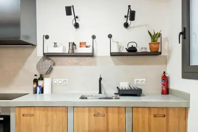 a kitchen with a sink and a counter top at Stay U-nique Tapioles Central Apartment in Barcelona