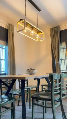 a dining room with a wooden table and chairs at Can Davilas Rustic Mountain House in Monistrol de Calders