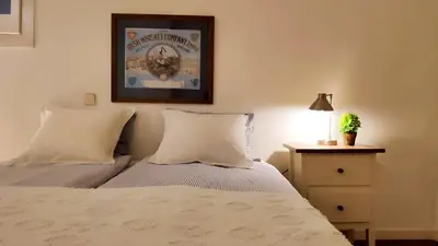 a living room with a couch and a table at Rambla-Plça Catalunya 2BR monthly stays -R.H in Barcelona