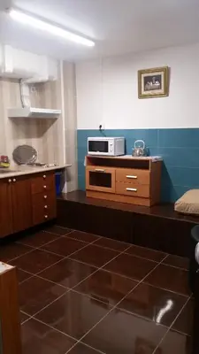 a kitchen with a counter with a microwave on it at Coliving 87 estudio numero 10 in Barcelona