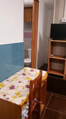 a room with a table with a flower pattern on it at Coliving 87 estudio numero 10 in Barcelona