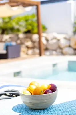 a bowl of fruit sitting on a table at Yasmine Casas Barcelona in Olivella