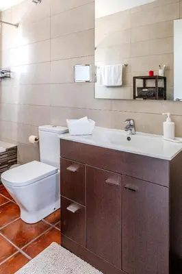 a bathroom with a toilet and a sink at Yasmine Casas Barcelona in Olivella