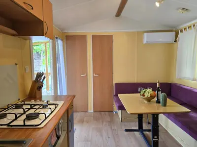 a kitchen with a stove and a counter top at Bungalow in Canet de Mar near Scenic Beach in Canet de Mar