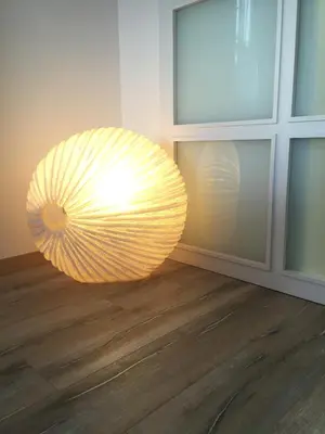 a large yellow orb light in a room at Rustic good in Sitges