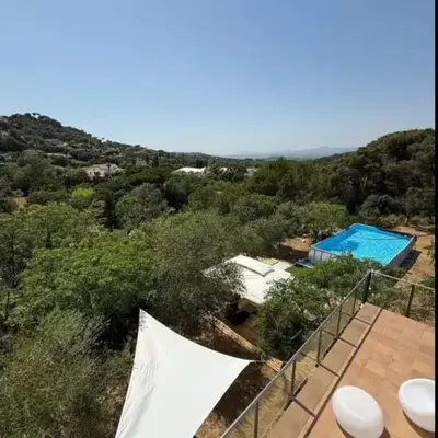 Large house surrounded by nature