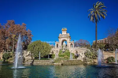 a building with a fountain in the middle of a pond at Sweett - Cosy Ciutadella in Barcelona