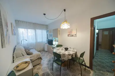 a living room with a couch and a table at Comodo y luminoso en Cornella -Barcelona- in Cornellà de Llobregat