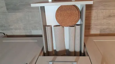 a spice rack with three measuring spoons on a kitchen counter at Vallgorguina Uno in Vallgorguina
