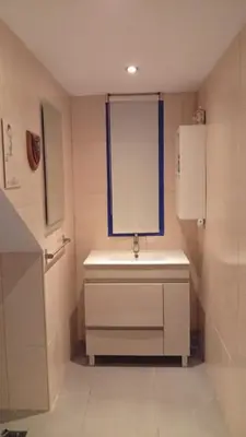 a bathroom with a sink and a window at El Portal, 12 mins from Sitges in Olivella