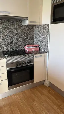 a kitchen with a stove and a counter top at Habitación mediana in Santa Coloma