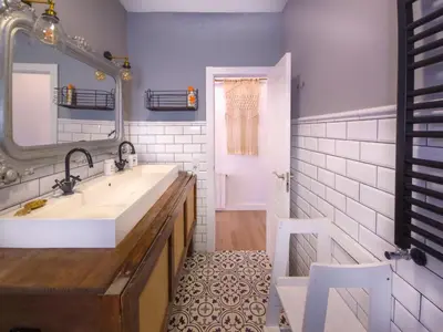 a bathroom with a sink and a mirror at Mikasi Hills by Hello Homes Sitges in Sant Pere de Ribes
