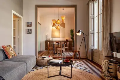 a living room with a couch and a table at Zagora - 2 bedrooms in Eixample Dreta in Barcelona