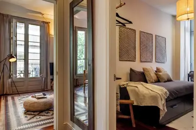 a bedroom with a bed with black walls at Zagora - 2 bedrooms in Eixample Dreta in Barcelona
