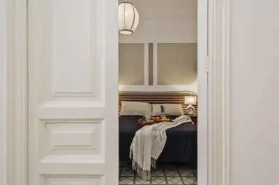 a living room with a couch and a table at Loma - 3 bedrooms and office in Eixample Esquerra in Barcelona