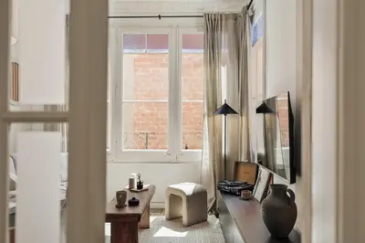 a bedroom with a bed with a bowl of fruit on it at Loma - 3 bedrooms and office in Eixample Esquerra in Barcelona