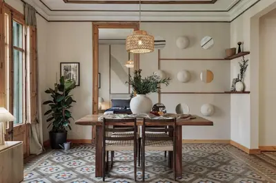 a hallway with a table and a dining room at Lura - 2 bedrooms and terrace in Eixample Esquerra in Barcelona