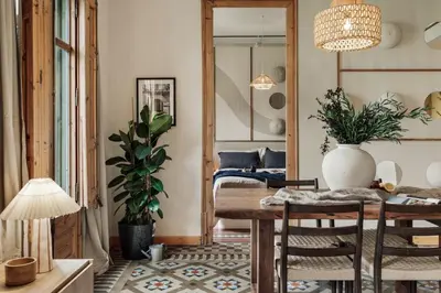 a living room with a couch and a table at Lura - 2 bedrooms and terrace in Eixample Esquerra in Barcelona