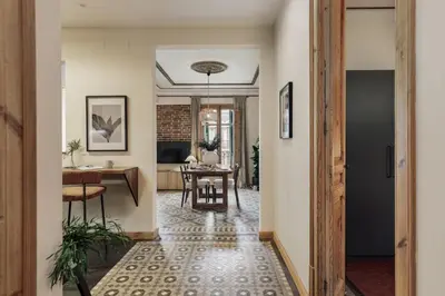 a bedroom with a large bed with a blue blanket at Lura - 2 bedrooms and terrace in Eixample Esquerra in Barcelona