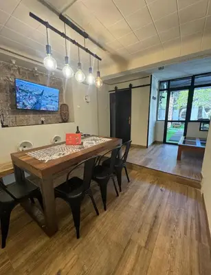 a large room with a wooden table and chairs at Hermoso Apartamento cerca a Barcelona in Sant Adria de Besos