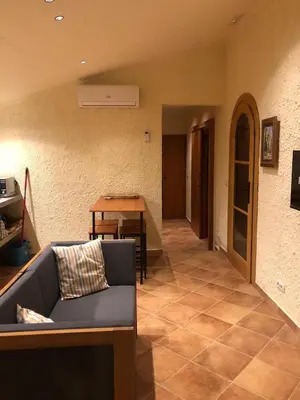 a living room with a couch and a table at Apartament rural in San Martín Sarroca