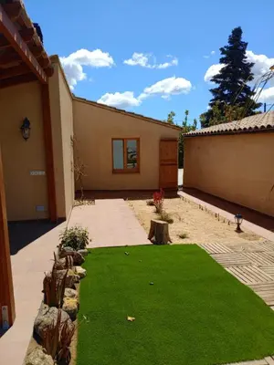 a backyard with a yard of green grass at Apartament rural in San Martín Sarroca