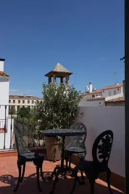 two chairs and a table on a balcony with a gazebo at Traumhäuschen am Meer für 2, Barcelona in Vilassar de Mar