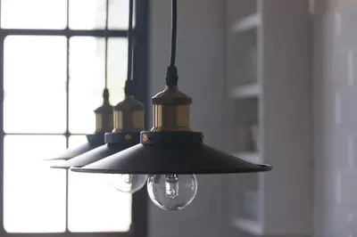 a group of three lights hanging from a wall at Traumhäuschen am Meer für 2, Barcelona in Vilassar de Mar