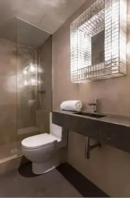 a bathroom with a toilet and a sink and a shower at Stay Unique Apartment Minerva in Barcelona