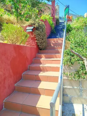 a set of stairs leading up to a house at casa vacacional con piscina privada in Sant Cebrià de Vallalta