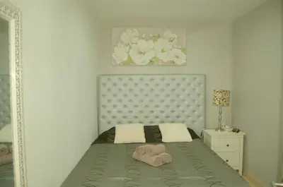 a bedroom with a bed with towels on it at casa vacacional con piscina privada in Sant Cebrià de Vallalta