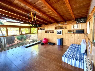 a room with a bowling alley in a house at Casa familiar con piscina cerca del mar y montaña in San Pol de Mar