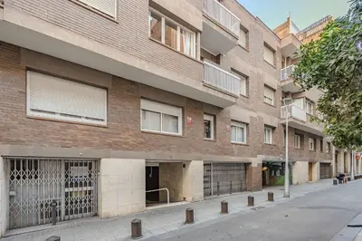 a large brick building on a city street at Bright Apartment in Barcelona in Barcelona