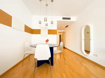 a dining room with a table and chairs at Boutique Socors in Barcelona
