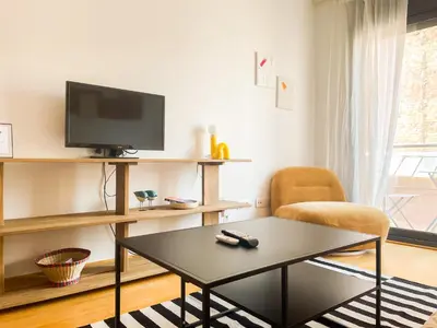 a living room with a tv and a coffee table at Boutique Socors in Barcelona