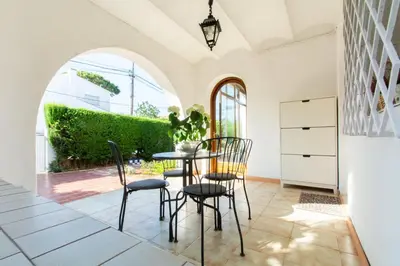 a dining room with a table and chairs at Mediterranean heaven with sea views in Alella