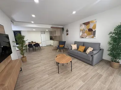 a living room with a couch and a table at Tr3sor 11 in Calella