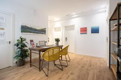 an office with a desk and chairs in a room at Vaganto Coliving in Barcelona