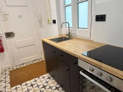 a kitchen with a sink and a counter top at Vaganto Coliving in Barcelona