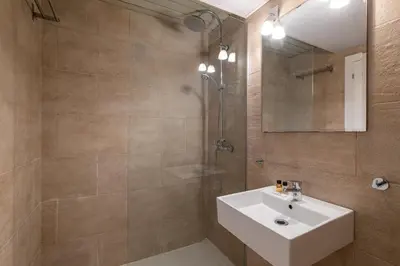 a bathroom with a sink and a shower at Stay Unique Apartment Taquigraf in Barcelona