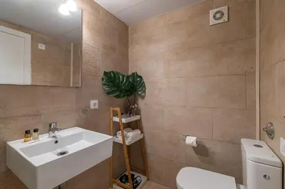a bathroom with a sink and a toilet at Stay Unique Apartment Taquigraf in Barcelona